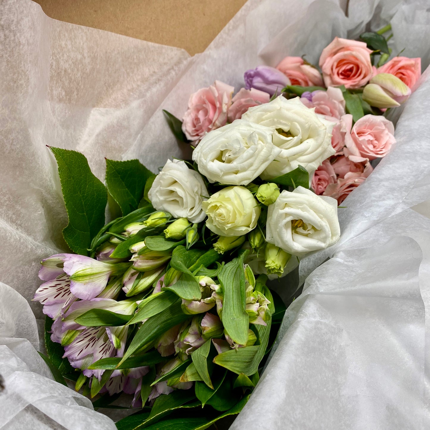 DIY Flower Box with pale pink, pale purple and white flowers with greens