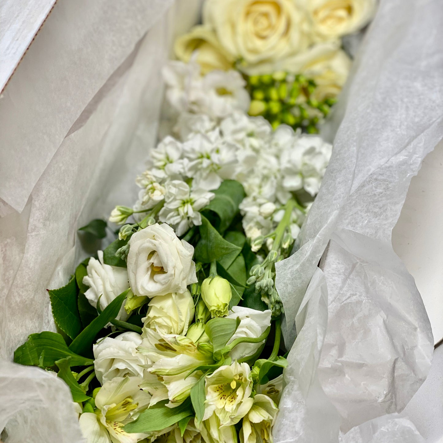 DIY Flower box with white and cream flowers and greens