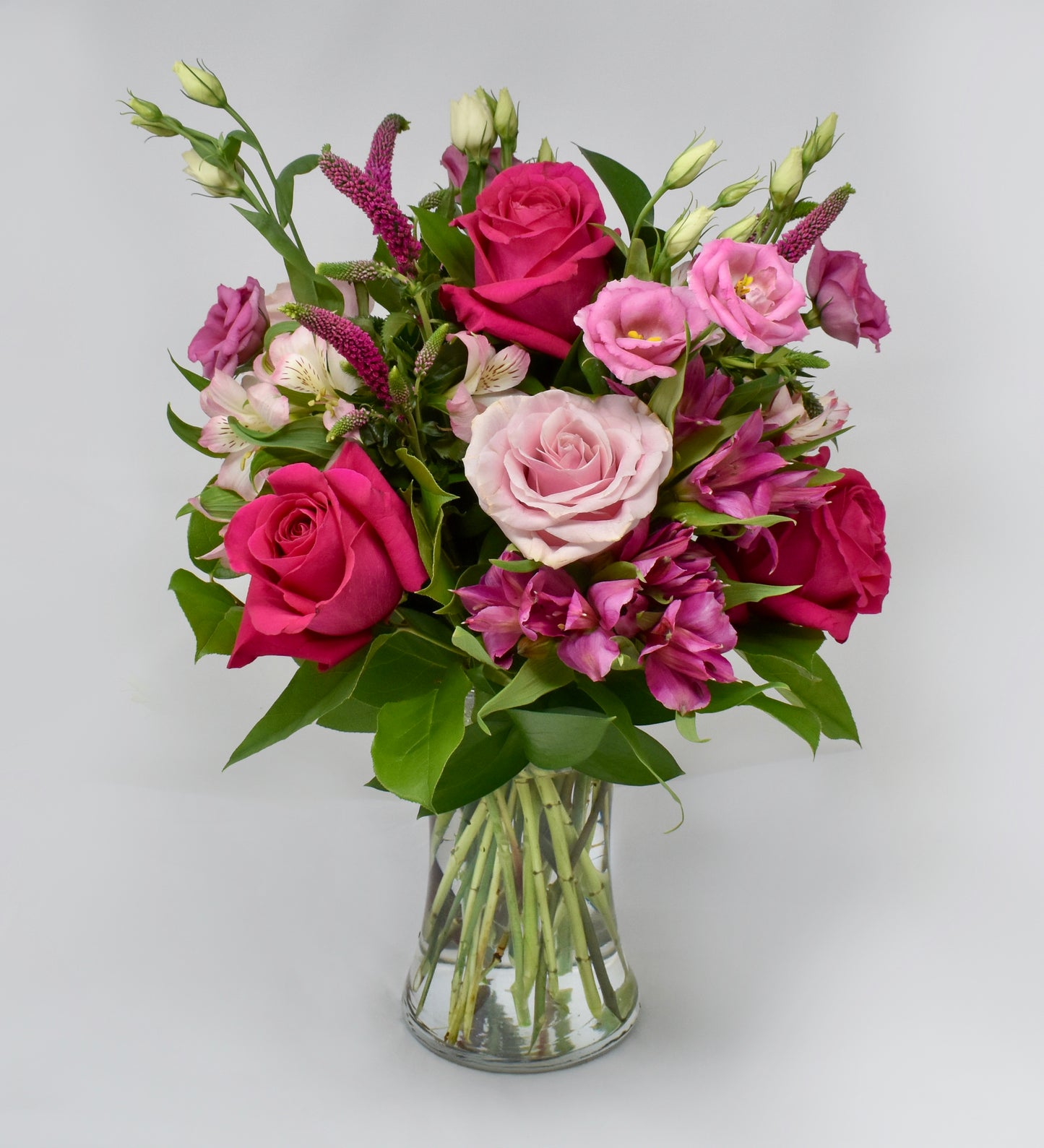 Pink flowers in a tall vase
